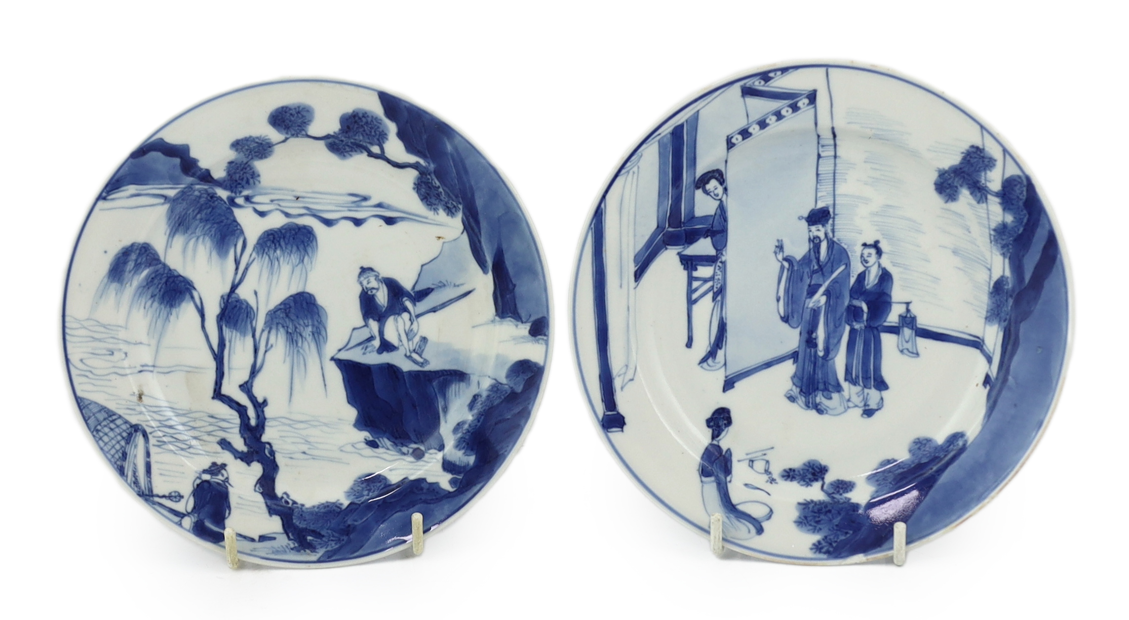 A pair of Chinese blue and white small plates, Kangxi period, hairline cracks to one plate.